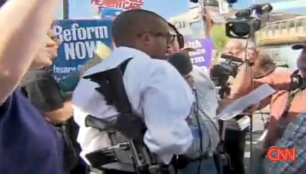 http://i676.photobucket.com/albums/vv126/kennyrk2/opencarryphoenixatobamaspeech.jpg?t=1250601967
