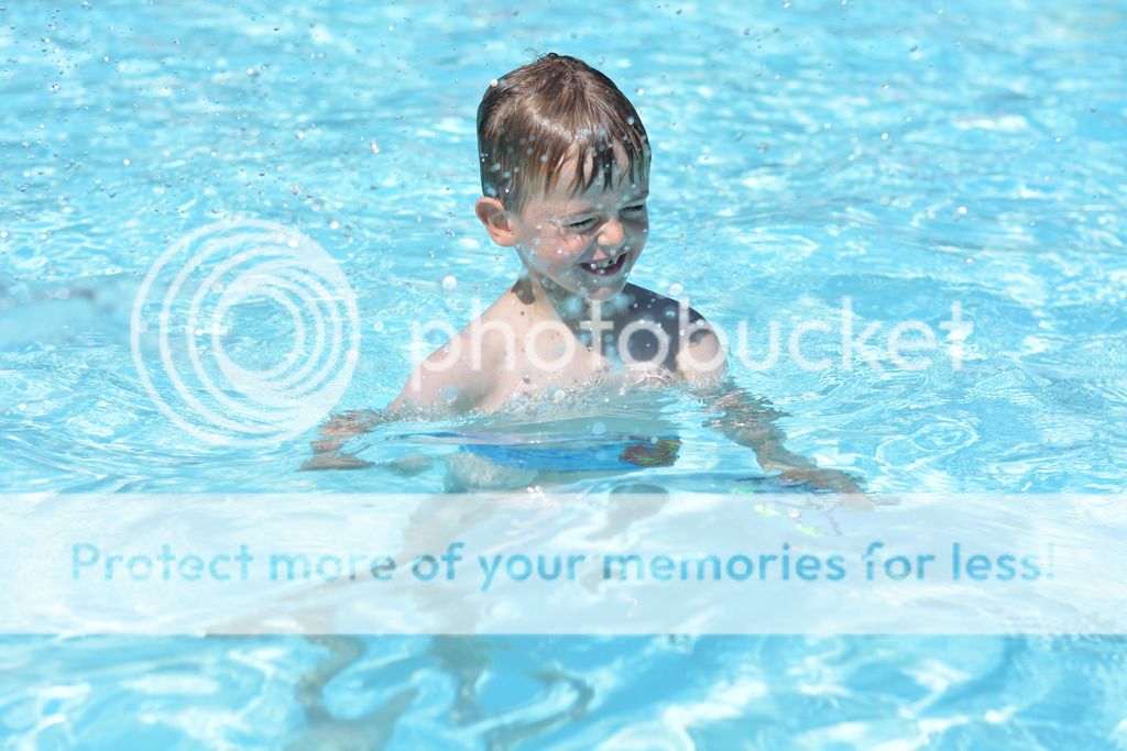 A young man in a pool of water